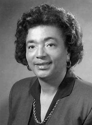 Dr. Yvonnecris Smith Veal, an African American woman with short hair in professional attire posing for her portrait.