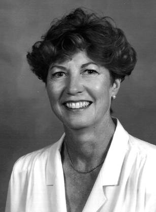 Dr. Catherine Gail Kincaid, a White woman with short hair smiling for her portrait.