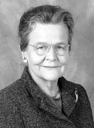 Dr. Mary Ellen Beck Wohl, an elderly White woman with glasses in professional attire posing for her portrait.