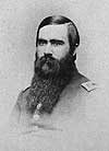 Head and shoulders left pose of Roberts Bartholow with a beard and wearing a military uniform.