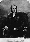 Three quarters length, full face, of Thomas Hodgkin seated in arm chair, legs crossed, hands in lap. 