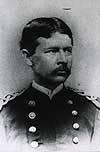 Head and shoulders, full face slightly left of Walter Reed wearing a military uniform and has a mustache.
