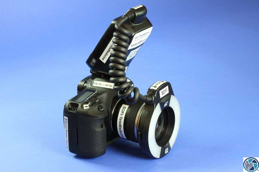 Camera with flash apparatus attached.