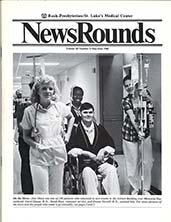 Cover of a newsletter with a photograph of nurses and patients in a hospital hallway.
