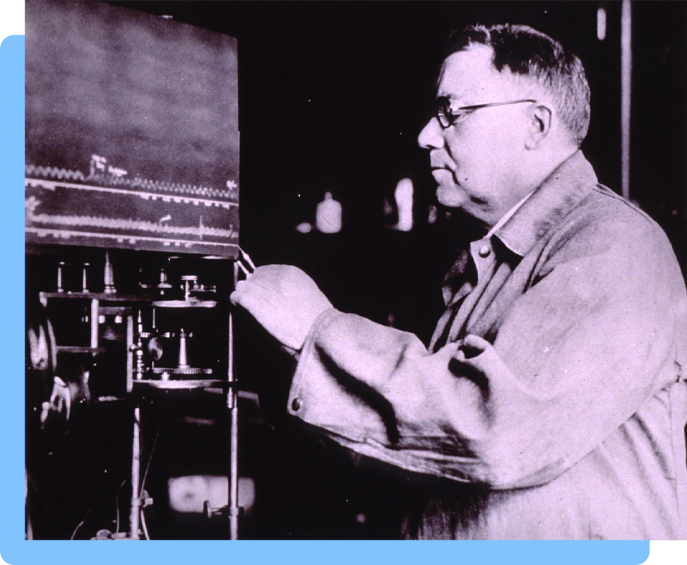 Profile of a man using a machine in a laboratory