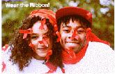 A color information card for Wear the Ribbon featuring head and shoulders view of a man and a woman wearing white shirts and red hats with red AIDS ribbons attached all over.