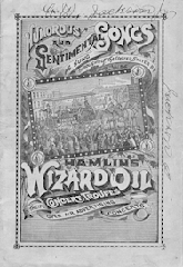 Cover of Humorous and sentimental songs as sung throughout the United States by Hamlin's Wizard Oil in the concert troupes open air advertising concerts. In the center is a image of a concert singing to a crowd in a carriage with horses.