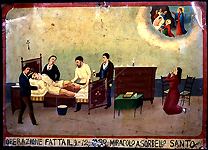 Santo Sorbello lies in bed while his doctor makes two incisions in his left leg. The doctor's assistant holds a roll of gauze while two other men steady Santo's leg and comfort him by placing their hands on his arm and head. A woman, perhaps his wife or sister, kneels in prayer to Saint Martha for Santo's recovery. "An operation performed 9-12-1933 - a miracle to Santo Sorbello." Oil on tin. Courtesy Giuseppe Maimone Editore, Catania and Mario Alberghina.