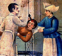 Close-up of Gina Attina while a doctor and nurse attend to her wounds at the local hospital. Courtesy Giuseppe Maimone Editore, Catania and Mario Alberghina.