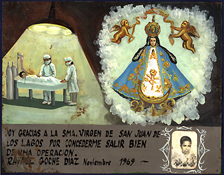 This modern ex-voto gives thanks for the recovery of a young boy from an operation. Two surgeons are shown in their scrubs and surgical masks while the boy lies on the operating room table connected to modern medical equipment. 1969, oil in tin, 13-1/5 x 10-1/5, Mexico. Courtesy Historia Antiques.