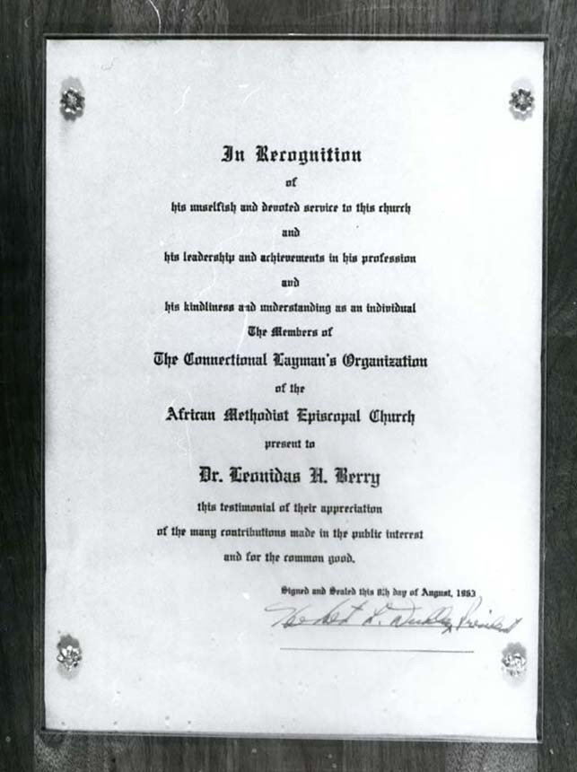 A plaque with typewritten text commemorating Dr. Berry.