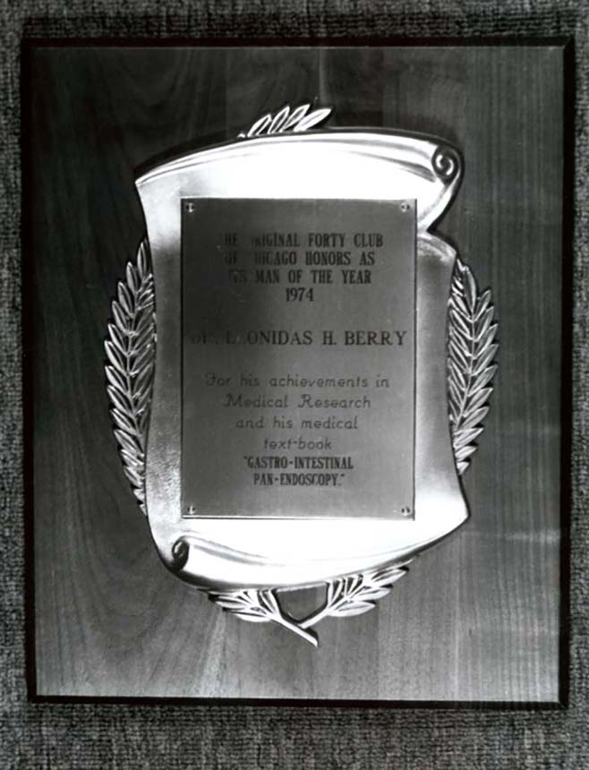 Plaque with engraved text to Dr. Berry.
