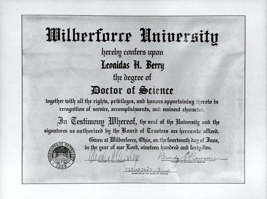 Diploma with text and handwritten signatures.