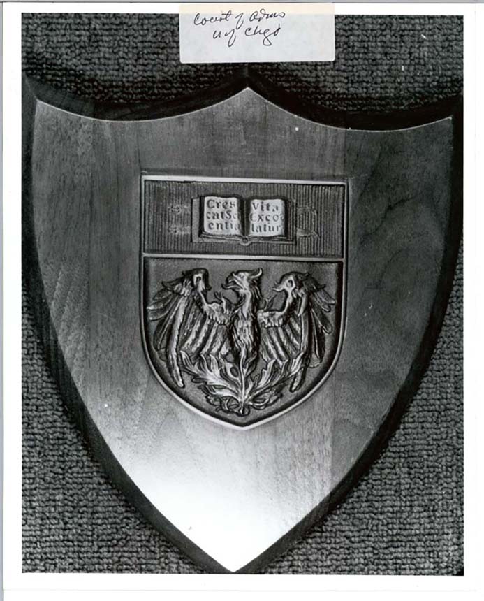 Plaque displaying coat of arms.