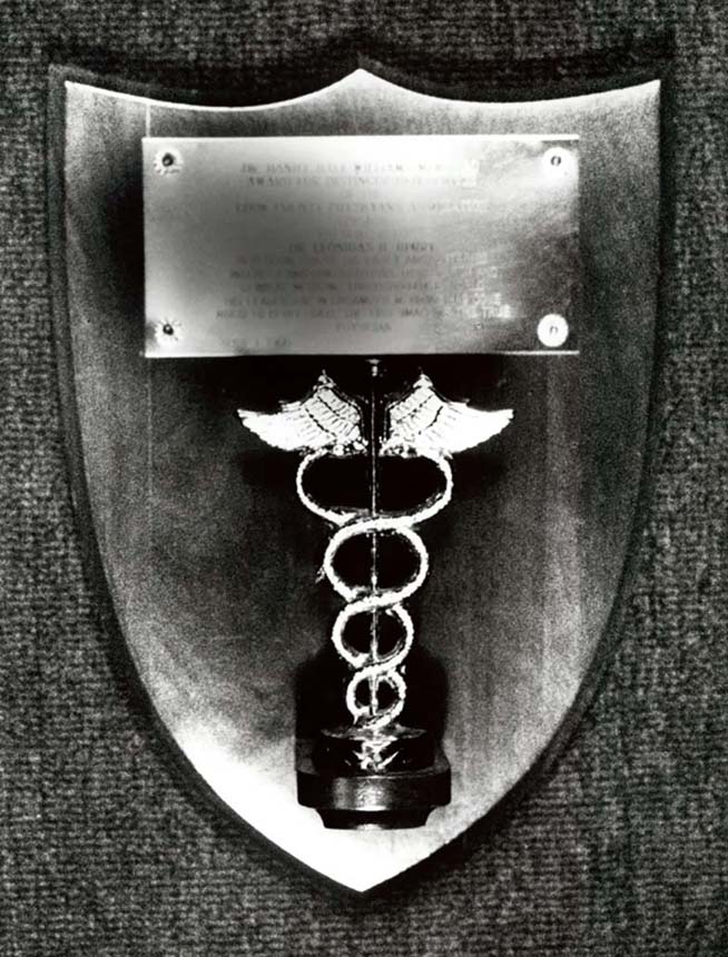 Plaque with medical symbol.