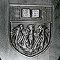 Plaque displaying coat of arms.
