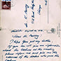 Postcard with handwritten text and stamps.