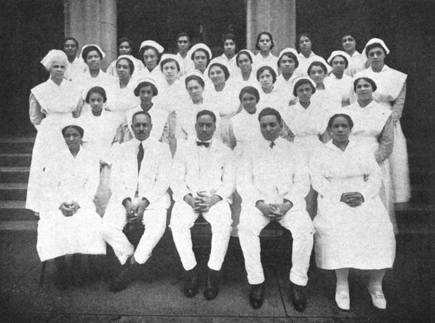 33 African American male and female doctors and nurses gathered for a group photograph