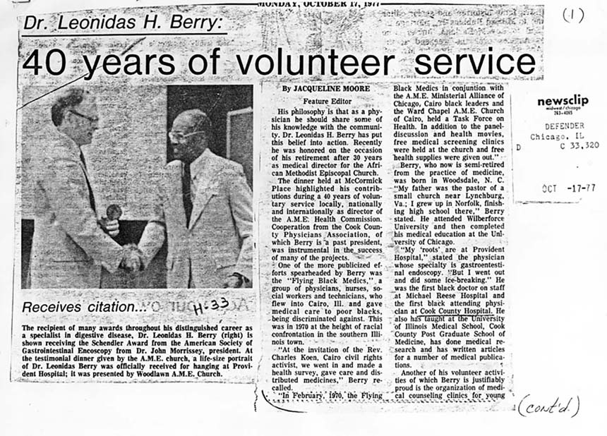 News clip with typewritten text and a photo of a black man (Dr. Berry) shaking hands with a white man.