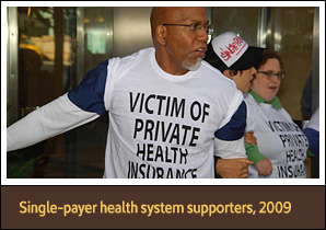 Three protesters linking arms in lobby, wearing shirts that say 'Victim of private health insurance.'