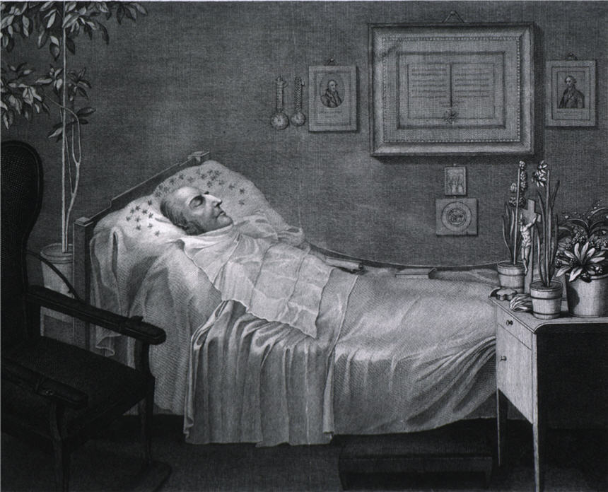 Man lying beneath a sheet in his death bed with plants on a table beside him.