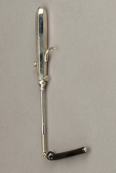 Metal insertion tool with tube holding attachment and intubation tube assembled for insertion in patient.
