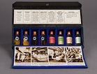 Opened sales kit shows eight glass vials representing the steps of manufacturing insulin and includes labels and photographs explaining the steps