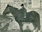 Black and white photograph of a child on the bare back of a dark colored horse in front of a stone building.
