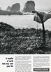 Magazine ad featuring a photograph of a hand grabbing dirt and particles spilling out back onto a beach.