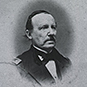 Charles S. Tripler in a uniformed outfit with a mustache and slicked back hair.