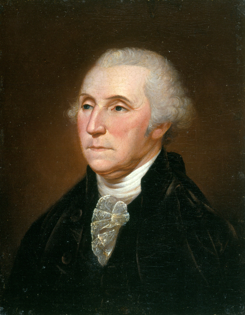 Washington with curly gray hair looking to the left in a black jacket, stoic expression.