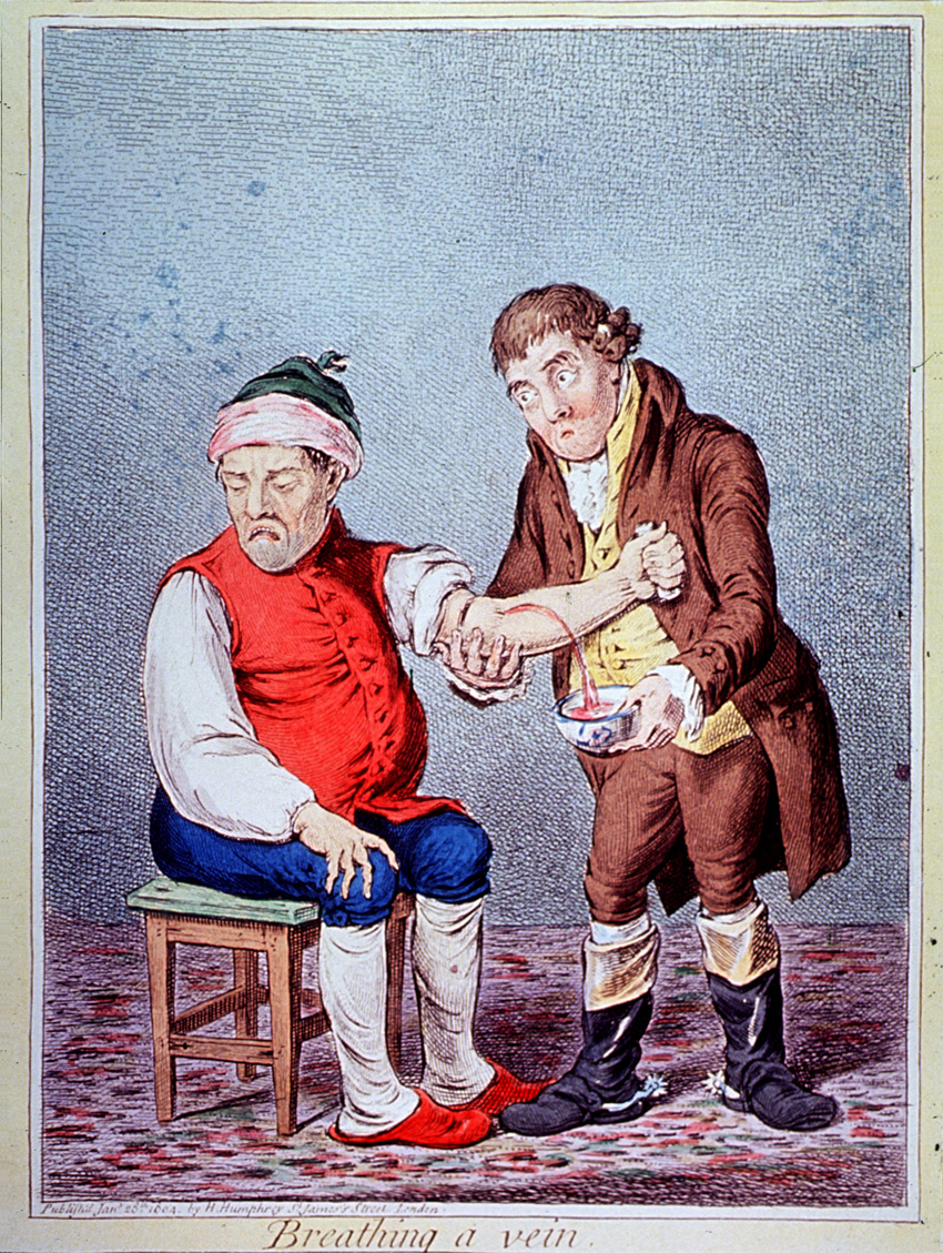 Man sitting down with another man holding his arm while blood spouts out of his arm into a bowl.