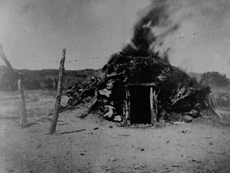 Burning of a Navajo Hogan that had been occupied by a victim of smallpox, near Indian Wells, Leupp Indian Reservation, Arizona,
circa 1890-1910. Courtesy the National Archives and Records Administration.