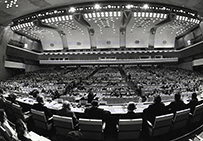 A large conference hall full of people.