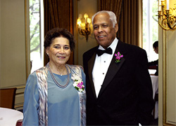 Image of a woman and man dressed in formal attire.