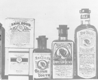 An array of various cosmetics in labeled boxes and bottles.