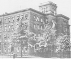Exterior view of the Butler Building from the front left corner. There are trees in front of the building.
