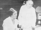 Half-length, full face of bacteriologists Ida A. Bengston seated on the left, and Alice C. Evans standing on the right.