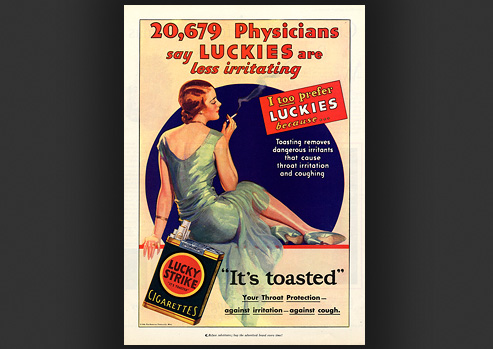 Advertisement with a woman smoking and lounging with a pack of cigarettes in the foreground.