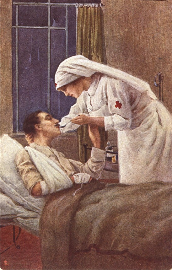 White female nurse holding a spoon to the mouth of a wounded White male soldier in bed.