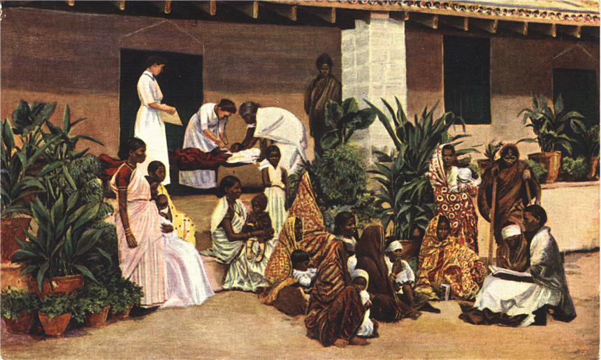 Two White female nurses assist a female Indian nurse. Many patients sit on hospital steps.