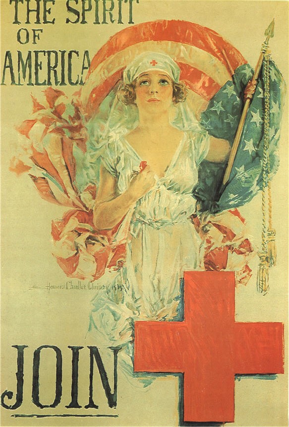 White female nurse holding American flag above 
