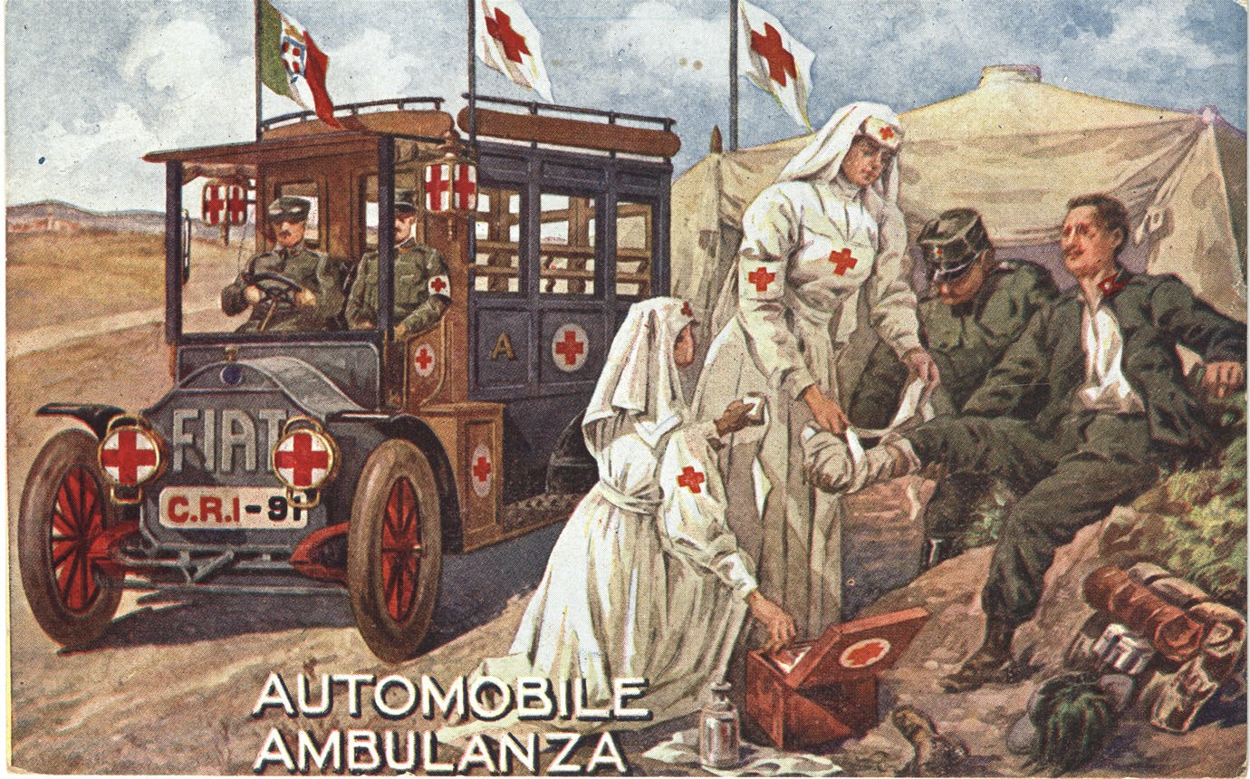 Two White female nurses and a male orderly, tend to a soldier, two orderlies arrive in ambulance.