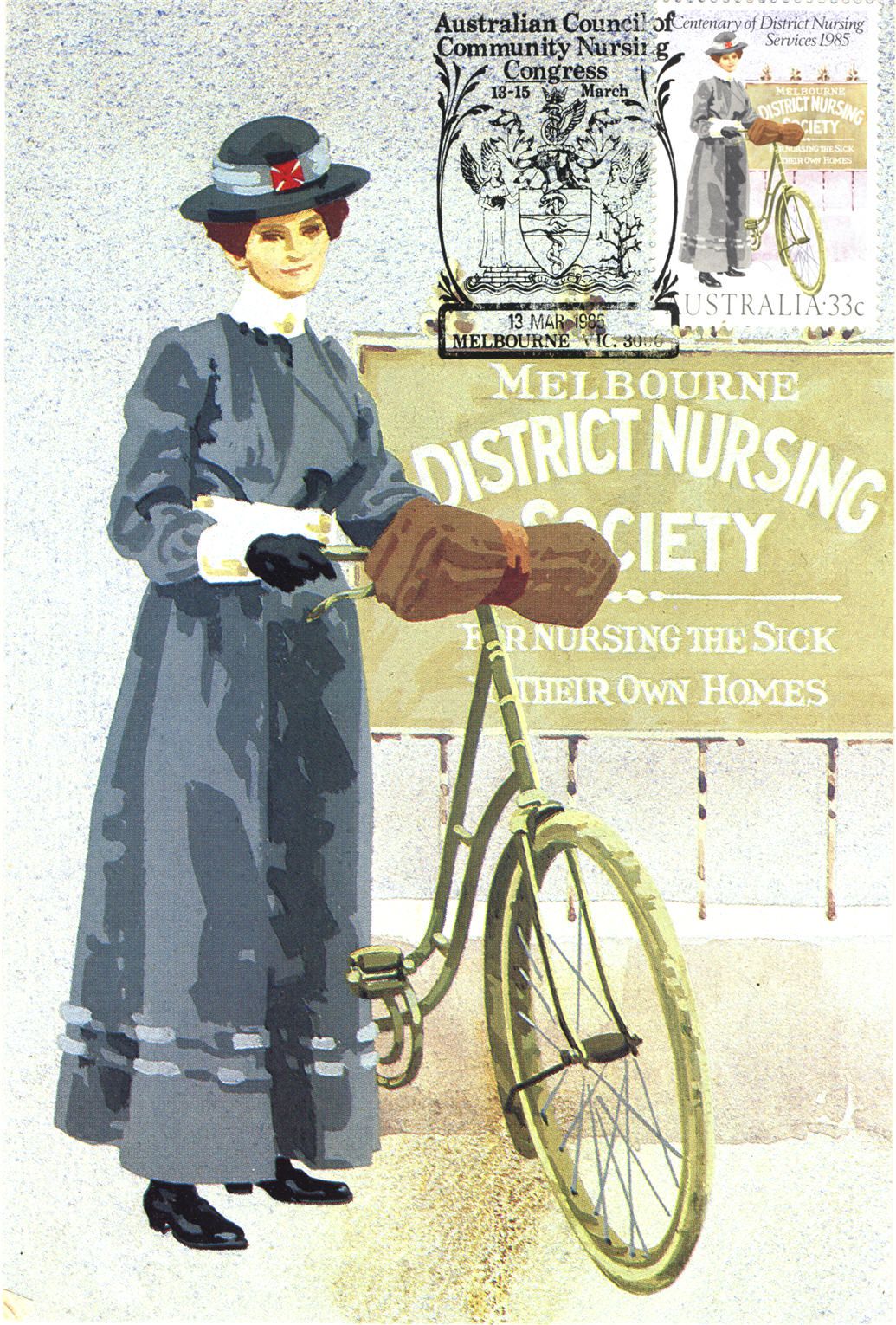 White female nurse in blue, standing holding a bike, looking at viewer.