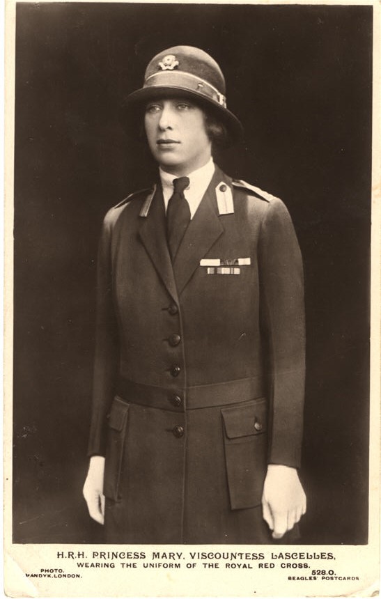 A White woman (Princess Mary), wearing the uniform of the royal Red Cross nurse.
