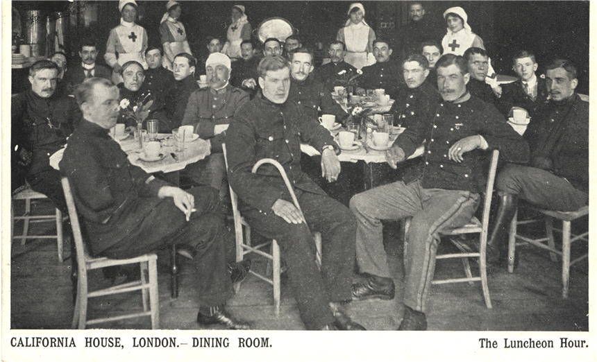 Twenty-three White male soldiers sitting in dining room with five White female Red Cross nurses.