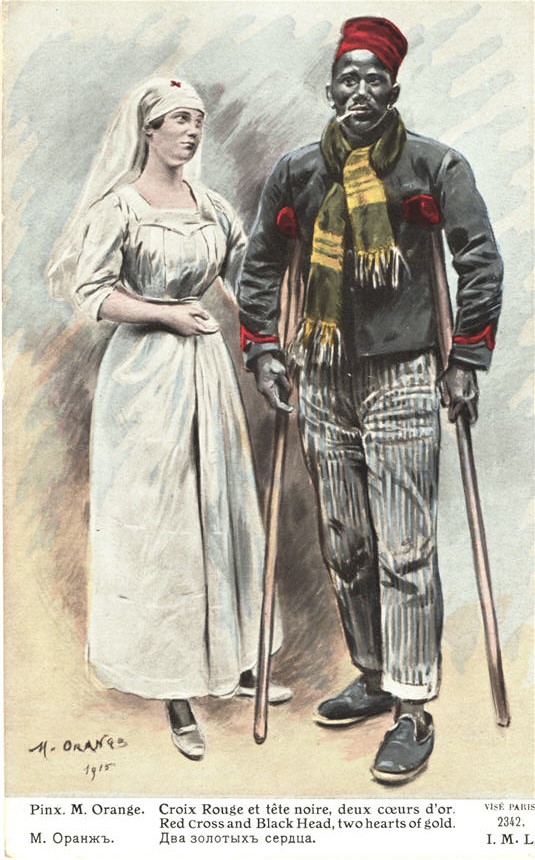A White female nurse standing beside and looking at a wounded African male soldier on crutches.