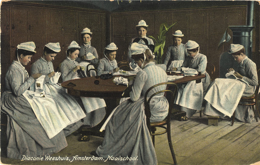 Ten White female nurses in gray sit around a table and sew.