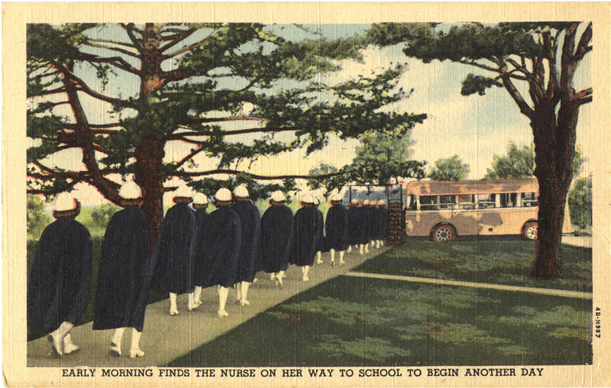 A line of White female nurses wearing blue capes, walking away from viewer, towards a bus.