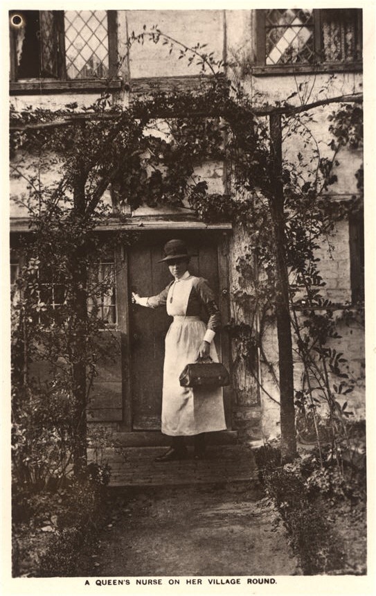 A White female nurse in white in front of a house with her hand on door, looking back at viewer